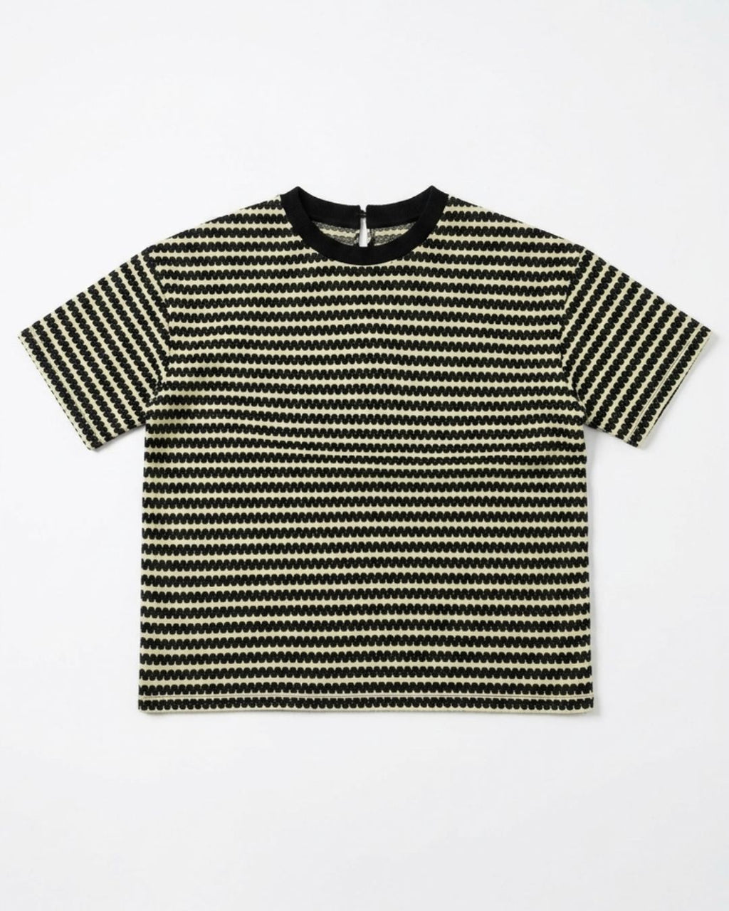A short-sleeve knit t-shirt with horizontal black and beige wavy stripes, featuring a solid black crew neck collar, laid flat against a light gray background.