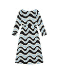A long-sleeve midi dress with a wavy, zig-zag pattern in black, light blue, and cream,  shown against a plain white background.