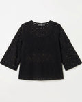 A black lace long-sleeve top with a round neckline, laid flat against a light off-white background.