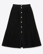A black pleated A-line midi skirt with a front button closure featuring gold-tone buttons, shown flat against a light gray background.