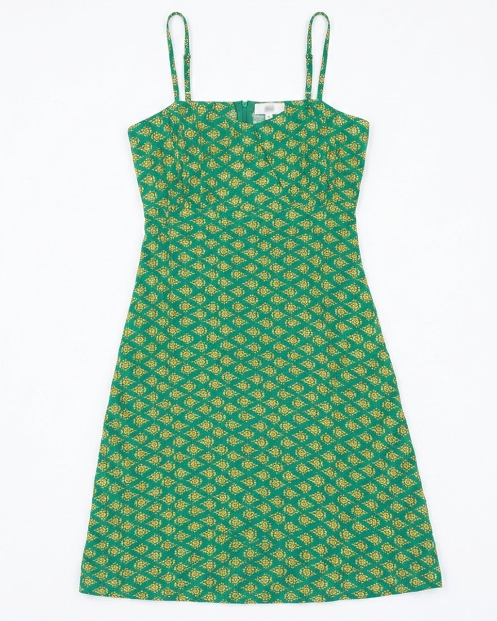 A green sleeveless dress with thin shoulder straps and an allover yellow geometric pattern, shown flat against a white background.