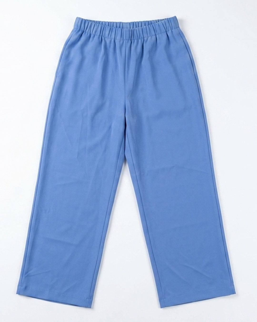 A pair of light blue  pants with an elastic waistband, laid flat against a white background.
