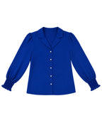 A royal blue long-sleeve blouse with a pointed collar, button-front closure, and gathered ruffled cuffs, shown flat against a plain white background.