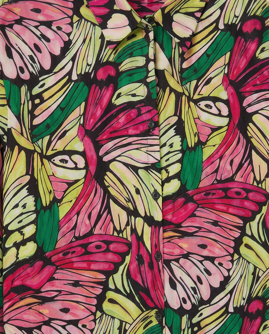A close-up of a button-front shirt with an all-over butterfly and leaf print in bright pink, green, yellow, and black.